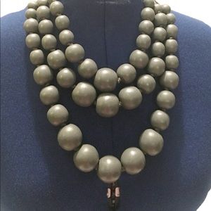 Wood multilayer necklace with back bead closure